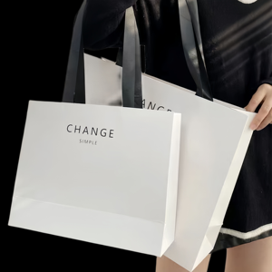 Bolsa de papel blanca sencilla con asa, caja autoarmable de papel artístico rectangular con impresión offset para negocios y compras - Product Image 1