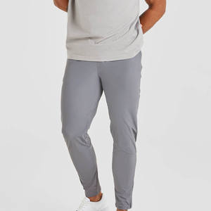 Joggers de tela elástica transpirables ajustados grises de alta calidad para hombre para cintura elástica de hombre y detalles de cremallera en el puño - Product Image 6