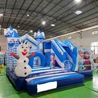 Château gonflable bleu Frozen avec toboggan pour location événementielle