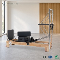 Machine de Pilates professionnelle en acier inoxydable avec cadre en bois de chêne durable et demi-tourneuse 2-en-1 pour studio de fitness