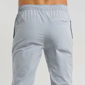 Pantalones grises clásicos: estilo elegante con dobladillo abierto con cómoda cintura híbrida y bolsillos funcionales - Product Image 5