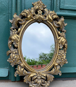 Elegant Oval Mirror with Acanthus <b>Leaves</b>, Richly <b>Decorated</b> with Floral Ornaments - Product Image 1