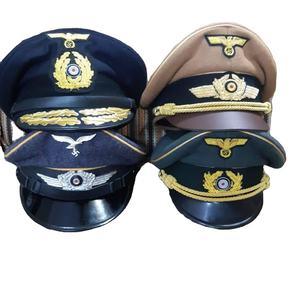 Extérieur en laine olive, visière en cuir marron et sangle de mentonnière, et un emblème d'aigle doré sur la casquette. - Product Image 1