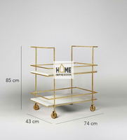 Chariots de service de luxe en verre propre et métal décoré avec une bordure dorée pour le dîner et le déjeuner