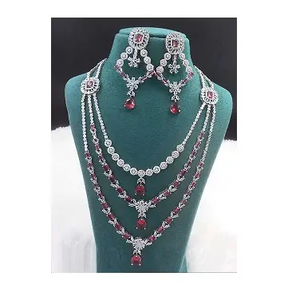 Le grossiste indien de confiance propose un ensemble de boucles d'oreilles collier en laiton AD éblouissant Style classique pour les événements spéciaux disponibles en vrac - Product Image 1