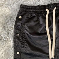 Pantalon d'athlétisme à boutons latéraux en nylon personnalisé de haute qualité pour l'extérieur coupe-vent imperméable pantalon en polyester pour hommes