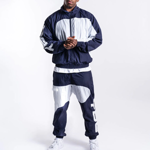 Conjunto cortavientos de nailon personalizado para hombre Diseño a prueba de viento de alta calidad Botón lateral elegante Técnica bordada de talla grande - Product Image 1