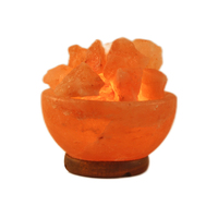 Lampe de bol de feu de sel de roche rose en cristal de l'Himalaya avec motif de fleurs sculptées 100% décor naturel comprenant des morceaux de sel