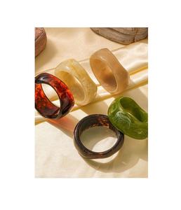 Modern <b>resin</b> napkin rings with metallic leaf accents embedded in <b>clear</b> <b>resin</b> for stylish minimalistic dinner tables - Product Image 3