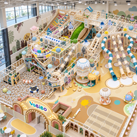 Aire de jeux commerciale intérieure en forme de tour circulaire avec toboggan tubulaire, filets d'escalade, piscine à balles et labyrinthe multi-niveaux pour centre commercial et salle de jeux familial (FEC), solution clé en main OEM
