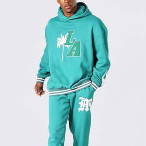 2025 élégant vêtements de sport hommes coupe ajustée à capuche coton survêtement conception élastique survêtements en vrac quantité solide motif tenues - Product Image 1