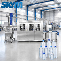 Machine automatique de lavage, remplissage et bouchage de bouteilles de petite taille pour eau minérale pure en bouteille