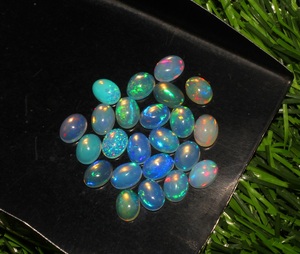 23-Piece Lot of Natural Ethiopian Opal 5x7mm Oval Shape Loose Gemstone Cabochons 23 Pieces Lot - Product Image 6