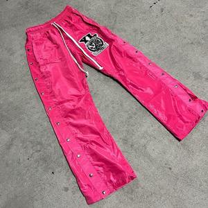 กางเกงและกางเกงของผู้ชายเสื้อกันลมผ้าไนลอนโพลีเอสเตอร์ขาบานติดกระดุมด้านข้างแบบลำลองใส่ได้ทั้งชายและชายโลโก้แบบกำหนดเอง2025 - Product Image 2