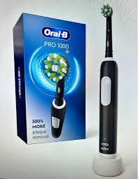 Brosse à dents électrique rechargeable Oral-B Pro 1000 authentique avec noir et blanc - Product Image 4