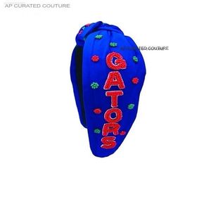 สายคาดศีรษะแบบสปอร์ตประดับลูกปัดผลิตจากอินเดียสำหรับวันแข่งขันเพื่อแสดงจิตวิญญาณของเชียร์ลีดเดอร์ของคุณ - Product Image 1