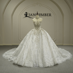 Vestido de Novia Moderno y Elegante GT26055 con Cuello Barco, Cola Capilla de Cristal, Encaje, Flores con Lentejuelas y Estilo Imperio Abullonado - Product Image 1