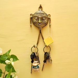 100% hecho a mano de latón puro arte máscara colgador de llaves 2x6 pulgadas estilo minimalista dorado DISEÑO DE Metal para coche/bicicleta decoración de pared colgante - Product Image 1
