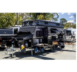 Caravane de camping robuste avec essieux tandem, suspension tout-terrain robuste et cuisine extérieure. - Product Image 5
