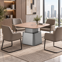 Table de réunion carrée de luxe avec structure en MDF et surface en pierre frittée pour espace de réception de bureau