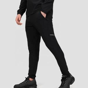 ชุดวิ่งกันลมสำหรับผู้ชายและผู้หญิงชุดกางเกงผ้าใบสไตล์ลำลองออกแบบได้ตามที่ต้องการ - Product Image 1