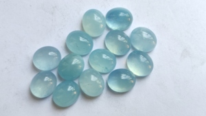 Haute qualité laiteux aigue-marine bleu naturel semi-précieux ovale coupe 6X8mm dos plat Cabochon fabrication de bijoux pierres en gros - Product Image 2
