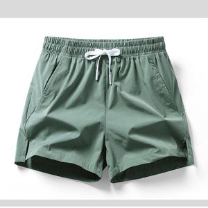 Vente en gros de shorts de sport athlétiques pour hommes séchage rapide basket-ball satin 100% polyester poches solides pour la course vêtements de sport décontractés - Product Image 1