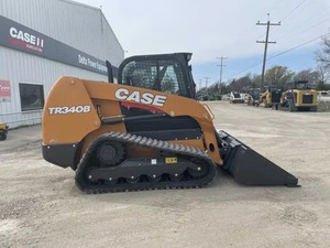 Chargeuse compacte sur chenilles TR340B d'occasion avec fourche et godet frontal – Équipement de construction - Product Image 1