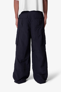 Pantalones de nailon con cordón holgados transpirables a prueba de viento para hombre bolsillos de carga personalizados impermeables frente plano estilo ancho de gran tamaño - Product Image 4