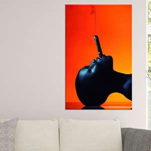 Tableau mural sur toile : Femme noire audacieuse avec cigare, impression orange spectaculaire, toile encadrée - Product Image 1