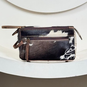 Hair-On Cowhide Leather Toiletry <b>Bags</b> with Zipper Closure Front Zip Pocket, Handle & Base Feet Travel Cosmetic Organizer Pouch - Product Image 1