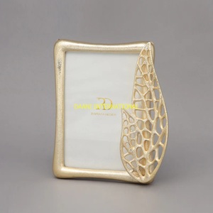 Gold Metal Photo <b>Frame</b> with Decorative Abstract Leaf Design Modern Home Decor Tabletop <b>Frame</b> for Gift and Office Decoration Use - Product Image 1