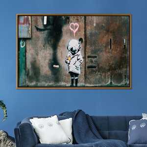 Arte abstracto en lienzo para pared: diseño impreso de Banksy Girl con diseño de pájaro, lienzo con marco dorado - Product Image 1