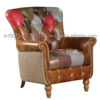 Canapé Chesterfield moderne une place en cuir véritable convertible, assise confortable et rembourrée, élément élégant pour appartement
