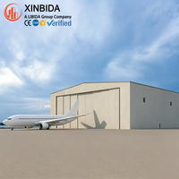 Hangar en acier robuste à portée libre pour le stockage et l'entretien d'avions, avec une forte capacité de résistance au vent et à la neige