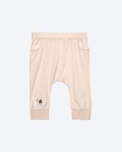 Pantalon de survêtement en tricot beige certifié OEKO-TEX pour filles, avec patch escargot sur la jambe gauche, style normcore/minimaliste, en coton biologique à carreaux - Product Image 1