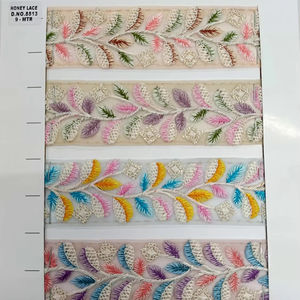 Tissu en dentelle brodée florale colorée vibrante et détaillée avec des motifs complexes, parfait pour la mode haut de gamme - Product Image 1