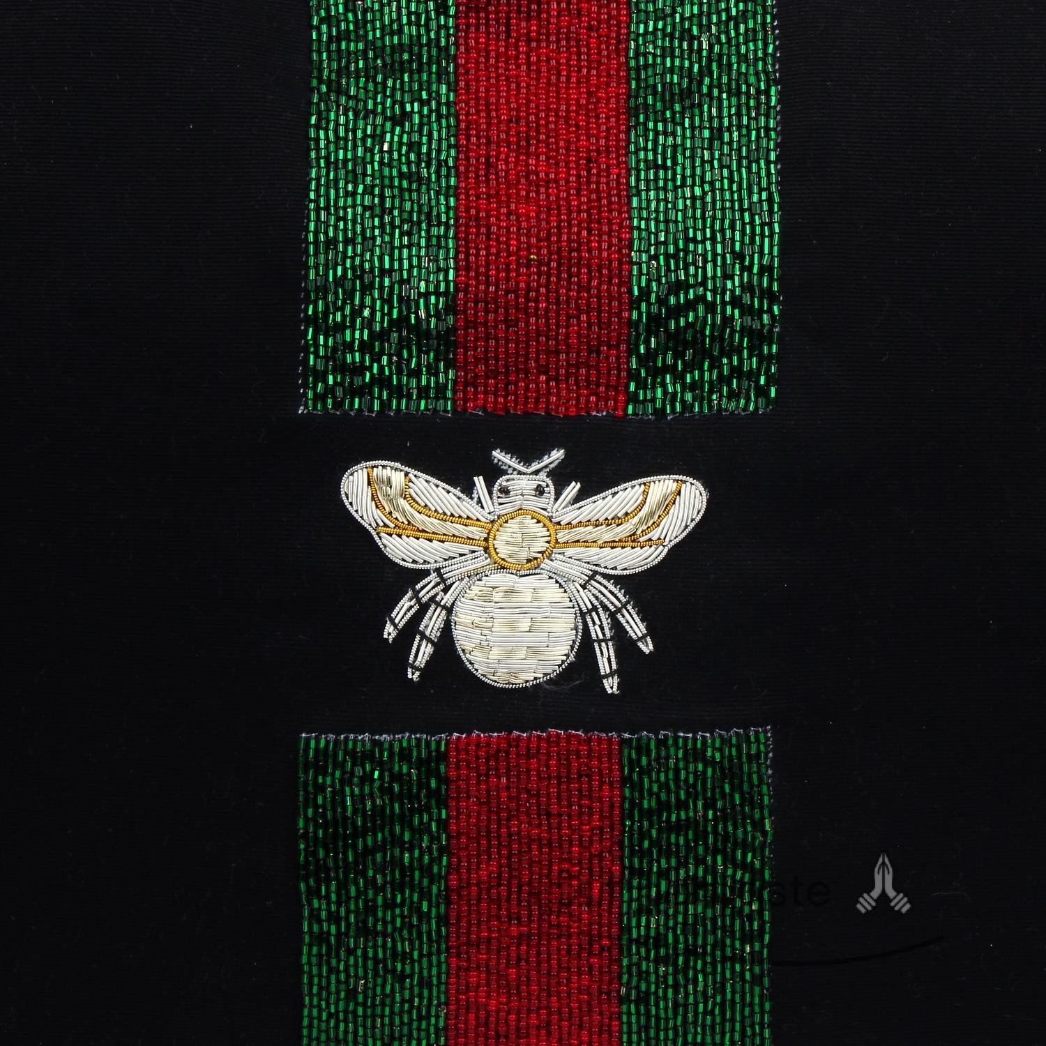 Black with red, green and silver motifs