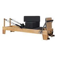 Reformer de Pilates Elite PUREFLEX en bois de chêne avec système de poulies réglables et rails silencieux, capacité de 200 kg, pour la rééducation et le renforcement musculaire