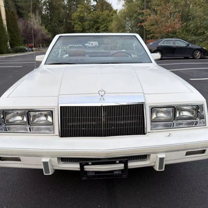 ใช้ปี 1983 สำหรับรถ LeBaron Base 2 ประตู เปิดประทุน พวงมาลัยซ้าย ภายในสีเข้ม เบาะหนัง ยาง R20 - Product Image 1