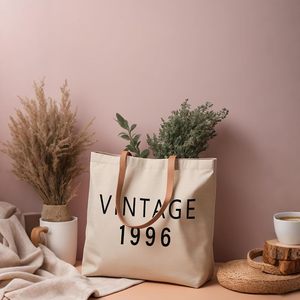 Christy Ng Umweltfreundliche Schwarze Canvas-Tragetasche mit Reißverschluss, Logo-Schulterriemen für Täglichen Gebrauch und Geschenke - Product Image 4