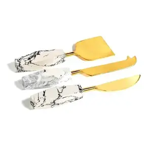 Esparcidor de queso chapado en oro y rebanador juego de cubiertos de acero inoxidable perfecto para Decoración de mesa de lujo al por mayor de La India - Product Image 1