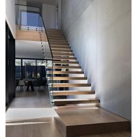 Cette Escalier Flottante Personnalisée en Bois d'Ingénierie Utilise une Structure de Poutre Laminée Cachée pour Créer l'Illusion de Marches Flottantes