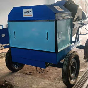 Portable industrial scrap shredder machine <b>mounted</b> on wheeled <b>frame</b> for recycling and material size reduction at factory yard - Product Image 1