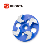 Disques abrasifs diamantés à quatre segments de flèche de 4 pouces Disques abrasifs personnalisés OEM pour béton Terrazzo avec axe