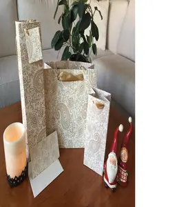 silk screen printed cotton rag handmade paper gift bags with paisley prints ideal for gifting and presentations in gold print