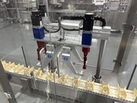 Ligne de remplissage automatique de lotion à 6 têtes avec pompe céramique servo - Gabarits réglables par écran et remplisseur anti-mousse à levage
