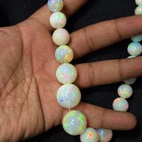 Perles d'opale naturelle éthiopienne lisses et rondes de 10 mm à 20 mm, de haute qualité, couleur arc-en-ciel, pour la fabrication de bijoux, plus de 50 ans d'expérience