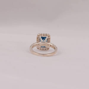 Fashionable Solitaire Blue Emerald Cut Lab Grown Diamond With Tiny Round Cut Diamond Halo Engagement Ring in 18KT <b>Solid</b> Gold - Product Image 3