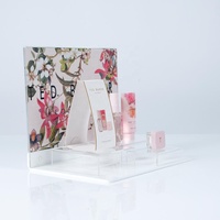 Présentoir de comptoir en acrylique transparent pour cosmétiques et parfums, 3 niveaux, avec panneau arrière pour affiches